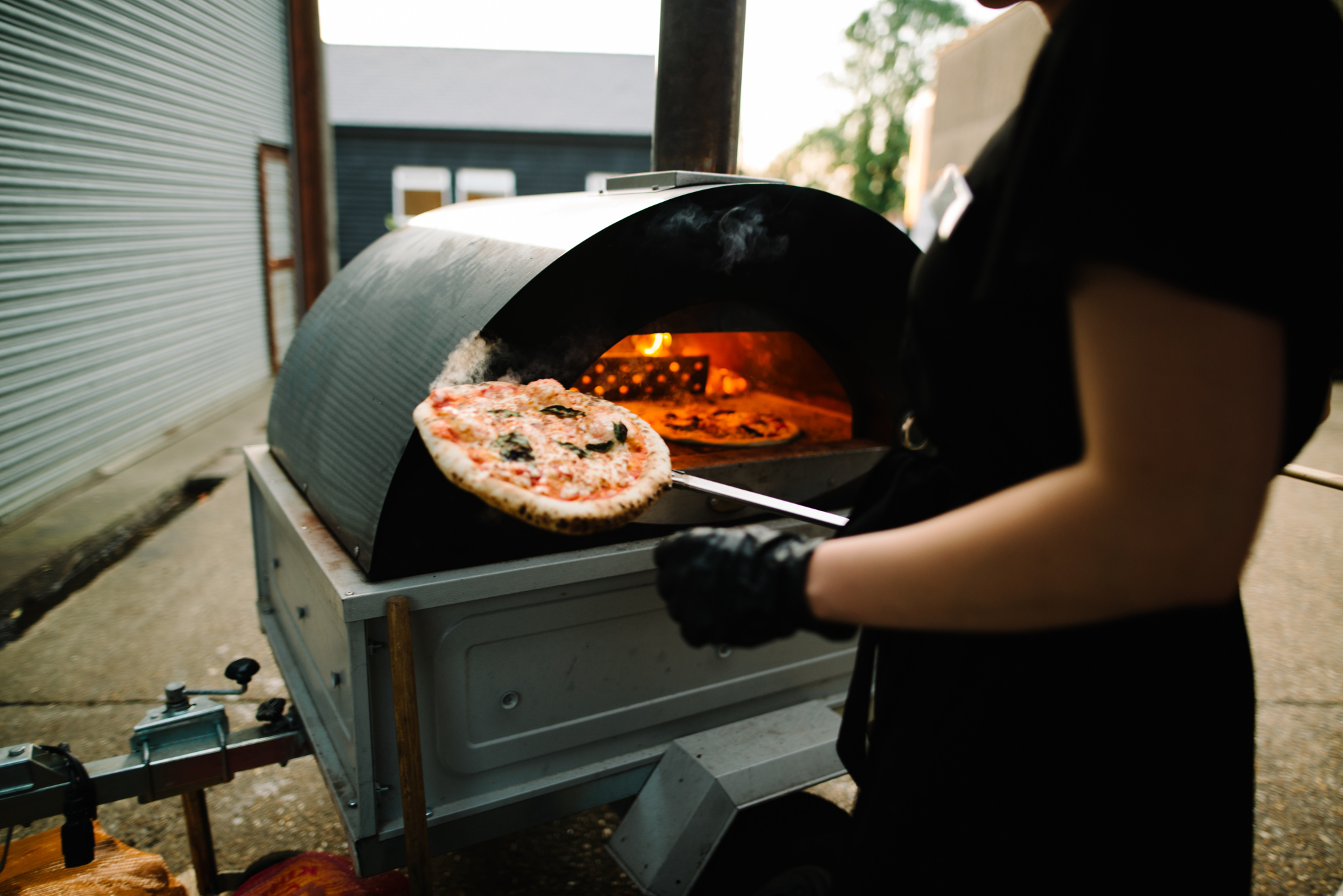 image of the best wood fired pizza catering Essex can offer from Plenty Of Thyme being cooked in oven