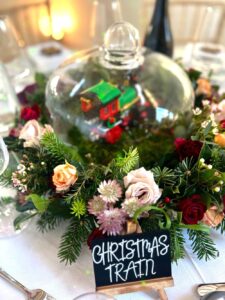 Xmas party catering table setting display of flowers